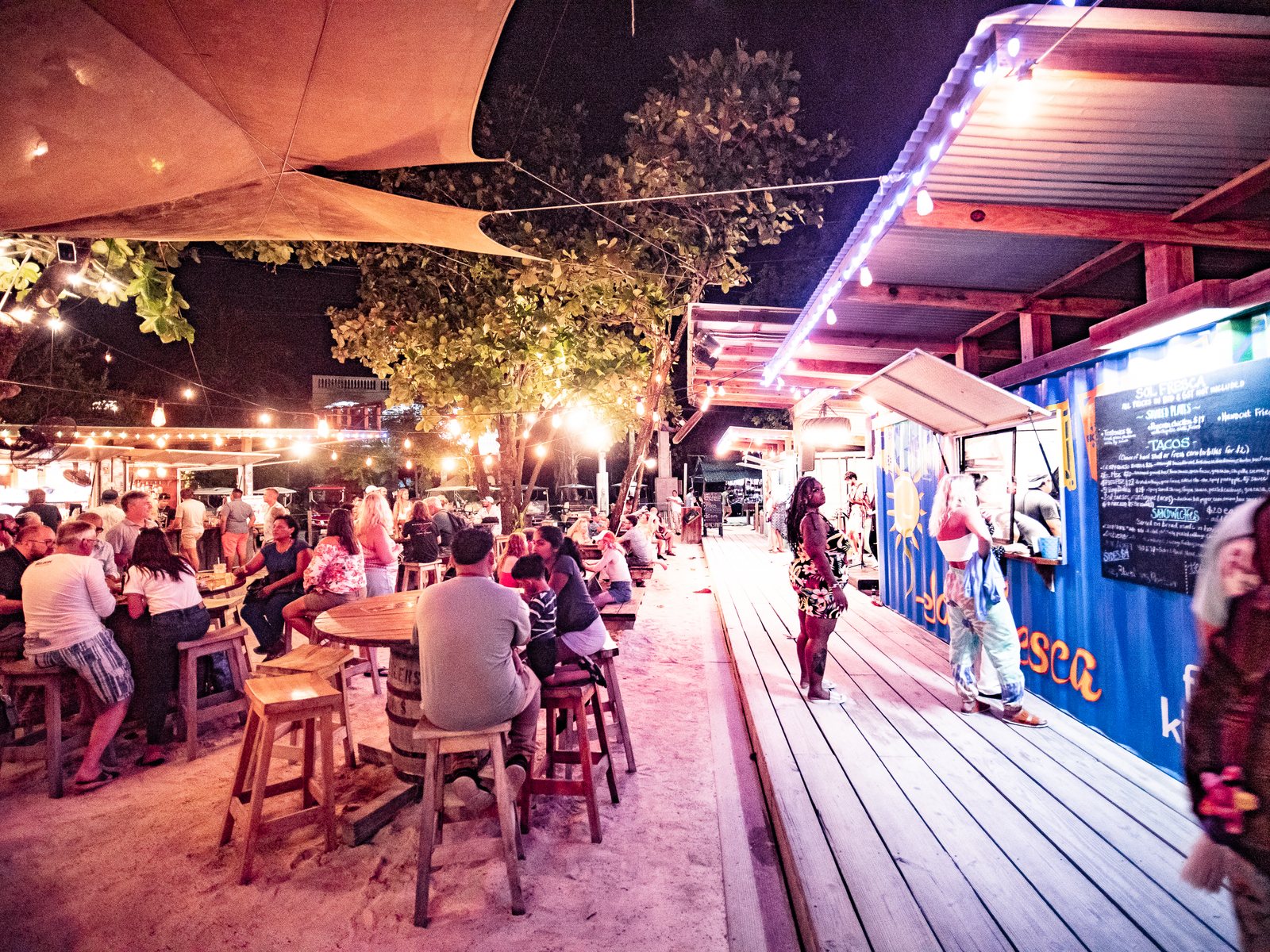 The lit restaurant fronts at The Truck Stop after dark